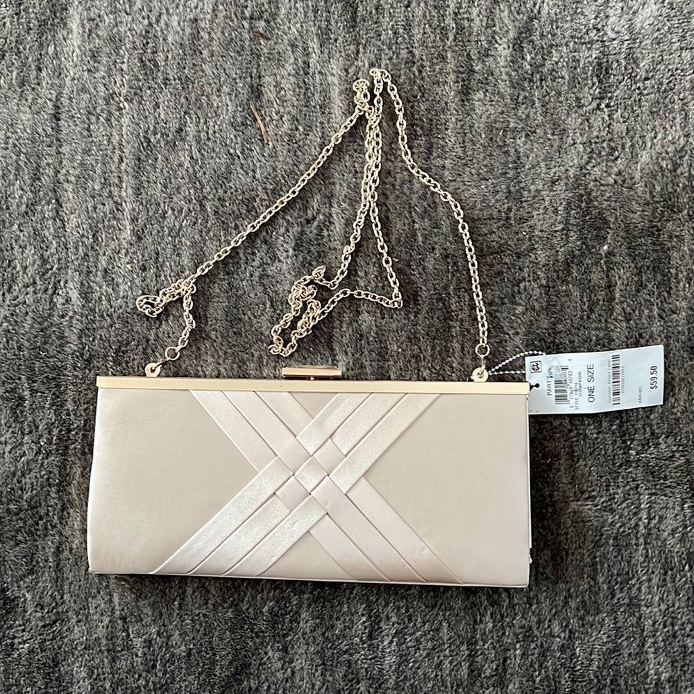 INC International Concepts Champagne colored evening clutch with gold chain.
